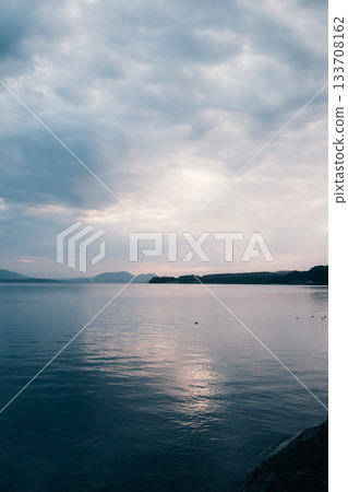 Dramatic clouds and light in the seascape 133708162