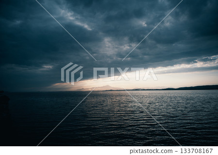 Dramatic clouds and light in the seascape 133708167
