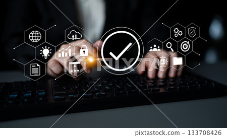Hands typing on a keyboard with digital icons representing data security, technology, and communication in a modern office environment Gantry Hands typing on a keyboard with digital icons representing data security, technology, and communication in a modern office environment Gantry 133708426