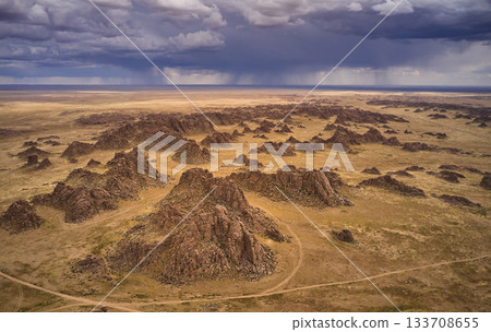 Aerial view of dramatic rock formations in an arid landscape 133708655