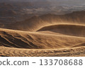 Experience breathtaking desert dunes and wind patterns at sunset 133708688