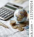 Visuals of currency and globes symbolizing macroeconomics and international finance 133709054