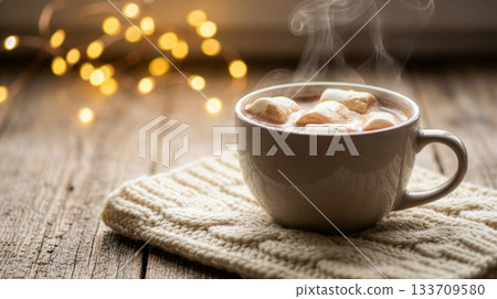 Steaming Hot Chocolate with Marshmallows on Knitted Cloth in Cozy Ambient Setting Steaming Hot Chocolate with Marshmallows on Knitted Cloth in Cozy Ambient Setting 133709580