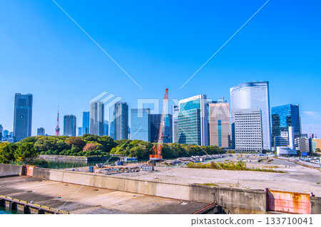 Tokyo cityscape in Japan: View of the Shiodome buildings, Roppongi, Azabudai, Tokyo Tower, the former Tsukiji Market, and demolition work 133710041