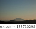 Mount Iwaki floating in the hazy spring evening sky 133710298