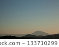 Mount Iwaki floating in the hazy spring evening sky 133710299
