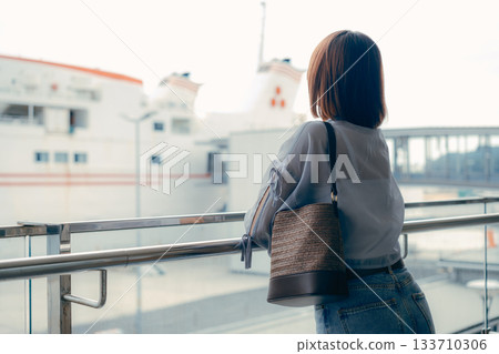 Profile scene of a woman looking at the dock 133710306
