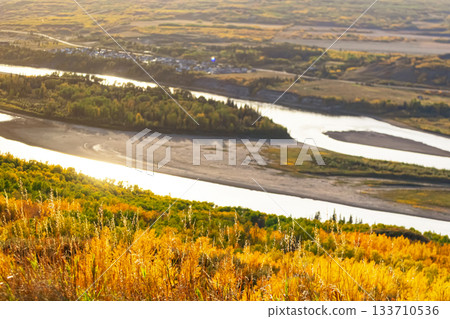 Majestic Peace River amidst yellow autumn forests. 133710536