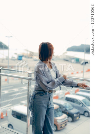 Portrait of a young woman smiling outdoors Portrait of a young woman smiling outdoors 133710568