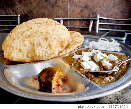 Chole bhature is a North Indian famous food dish. Chole bhature is a North Indian famous food dish. 133711424