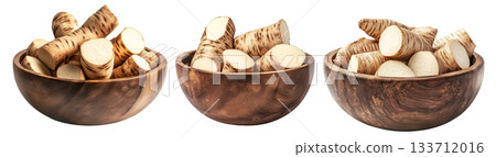 Freshly cut taro root pieces in wooden bowl isolated on white transparent background. Concept of organic food, tropical vegetables, and healthy nutrition Freshly cut taro root pieces in wooden bowl isolated on white transparent background. Concept of organic food, tropical vegetables, and healthy nutrition 133712016
