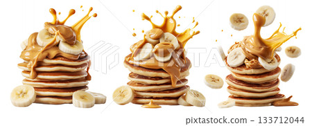 Stack of pancakes topped with banana slices and peanut butter splash isolated on white transparent background 133712044