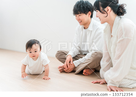 Parents and children playing with their babies in the living room, family, couple 133712354