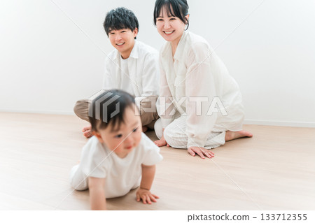 Parents and children playing with their babies in the living room, family, couple 133712355