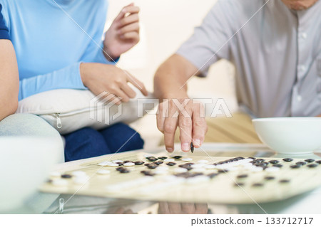 Encouraging the elderly to play brain-stimulating games like this helps prevent memory-related illnesses such as dementia. Encouraging the elderly to play brain-stimulating games like this helps prevent memory-related illnesses such as dementia. 133712717