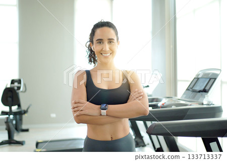 Sportswoman's portrait in the indoor gym. Sportswoman's portrait in the indoor gym. 133713337