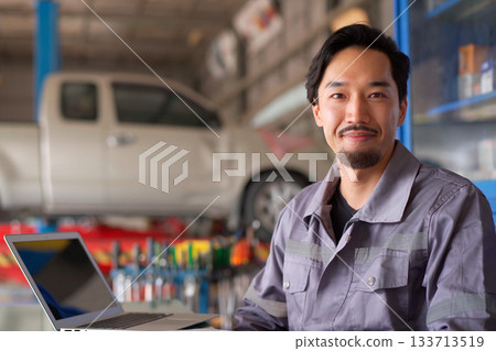 Repairman portrait in garage. 133713519
