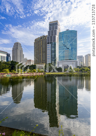 Benjakitti Park and skyscrapers in Bangkok, Thailand Benjakitti Park and skyscrapers in Bangkok, Thailand 133713728