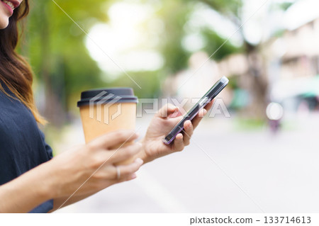 Asian businesswoman walking on the street in city. 133714613