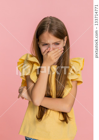 Child girl kid pretending to cry and lowering head with sad emotional expression in dramatic gesture Child girl kid pretending to cry and lowering head with sad emotional expression in dramatic gesture 133714771