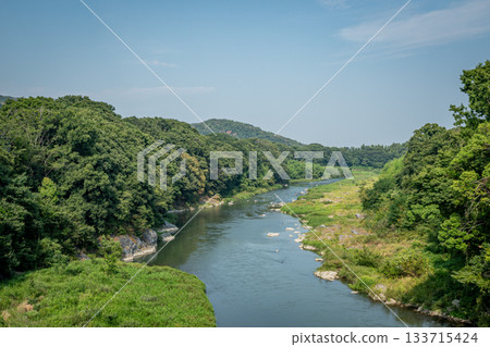 Lush green valley scenery overlooking the Arakawa River in Yorii Town in summer Lush green valley scenery overlooking the Arakawa River in Yorii Town in summer 133715424