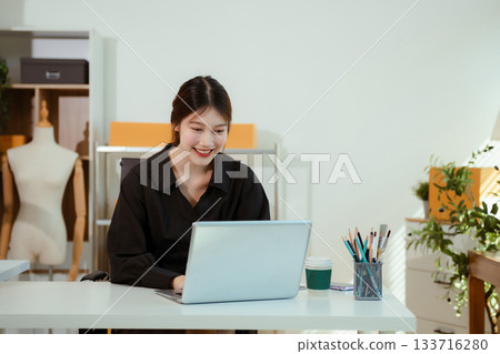 Woman selling products online.entrepreneur or freelance checking orders from customers, woman runs an e-commerce business on websites and social media Woman selling products online.entrepreneur or freelance checking orders from customers, woman runs an e-commerce business on websites and social media 133716280