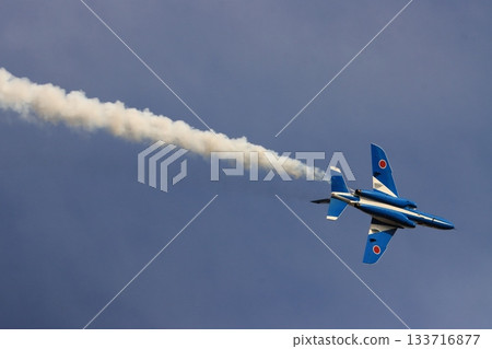 Slow roll of Blue Impulse No. 6 aircraft, trailing smoke. 133716877