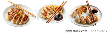 Golden pan-fried Japanese gyoza dumplings served on plate, isolated on white background, concept of Asian cuisine 133717657