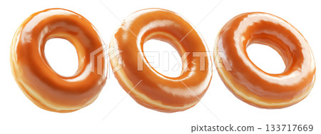 Tasty round donut topped with caramel and vanilla glaze swirl, isolated on white transparent background 133717669