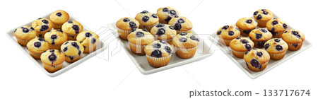 Nine golden blueberry muffins with juicy berries in rows arranged in a white tray, isolated on white background 133717674