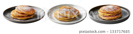 Stack of fluffy golden pancakes sprinkled with powdered sugar on a ceramic plate, isolated on white background 133717685