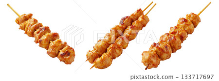 Grilled chicken Satay skewer with a golden brown glaze, isolated on white background, concept of tasty street food Grilled chicken Satay skewer with a golden brown glaze, isolated on white background, concept of tasty street food 133717697