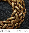 Intricate Gold Braided Texture with Shiny Metallic Finish 133718175