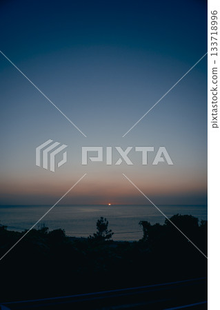 Sunset over the Sea of Japan and a tranquil seascape 133718996