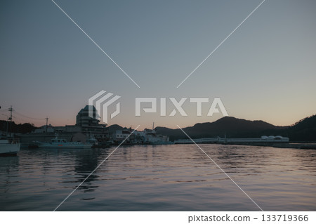 A quiet morning view of the harbor and lighthouse A quiet morning view of the harbor and lighthouse 133719366