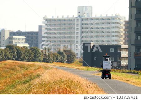 River office staff patrolling the Arakawa riverbed (Kita Ward, Tokyo) 133719411