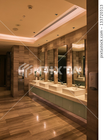 modern white ceramic wash basin in public toilet or restaurant or hotel or shopping mall or luxury lounge, interior design. modern white ceramic wash basin in public toilet or restaurant or hotel or shopping mall or luxury lounge, interior design. 133720313