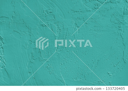 Close up turquoise colored painted plaster wall surface background with rough brushstrokes texture 133720405