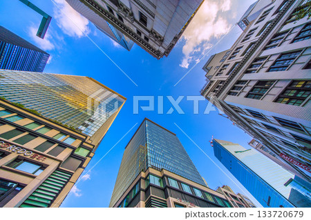 Tokyo cityscape in Japan. View of the skyscrapers of Nihonbashi bathed in the sunset and the redevelopment project of Nihonbashi 1-chome. Towards a new era Tokyo cityscape in Japan. View of the skyscrapers of Nihonbashi bathed in the sunset and the redevelopment project of Nihonbashi 1-chome. Towards a new era 133720679