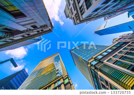 Tokyo cityscape in Japan. View of the skyscrapers of Nihonbashi bathed in the sunset and the redevelopment project of Nihonbashi 1-chome. Towards a new era 133720735