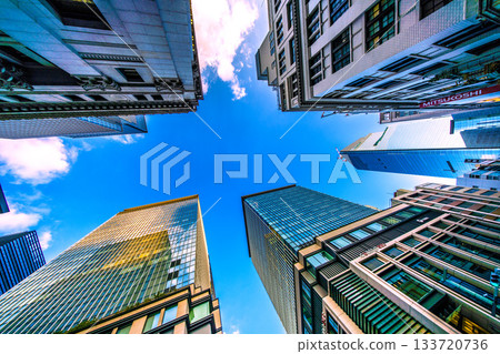 Tokyo cityscape in Japan. View of the skyscrapers of Nihonbashi bathed in the sunset and the redevelopment project of Nihonbashi 1-chome. Towards a new era 133720736