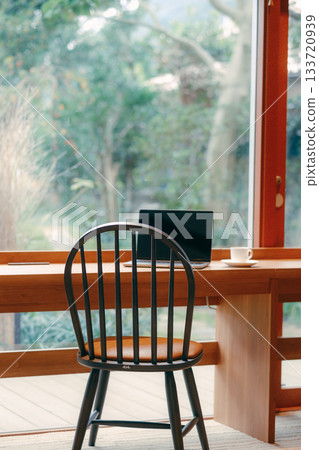 Laptop and coffee on a desk in a coworking space Laptop and coffee on a desk in a coworking space 133720939