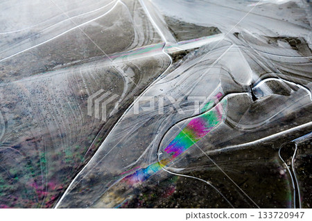 Abstract pattern of iridescent thin ice 133720947