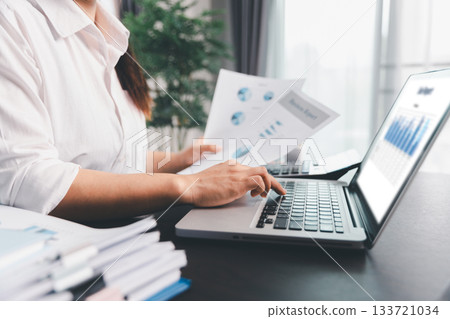Business woman analyze calculate company financial, tax results office accounting statistics analytical research. calculating business balance prepare tax reduction. Tax deduction planning concept. Business woman analyze calculate company financial, tax results office accounting statistics analytical research. calculating business balance prepare tax reduction. Tax deduction planning concept. 133721034