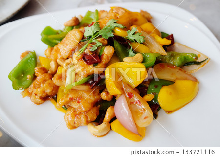 Stired-fried Chicken with Cashew Nuts in white dish. Thai food Stired-fried Chicken with Cashew Nuts in white dish. Thai food 133721116