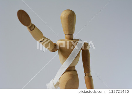 Drawing doll, sash, hands raised (front) 133721420