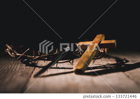 Crucifixion of Jesus Christ, nail-pierced hands, crown of thorns, cross, symbol of Christianity, representing holy sacrifice, passion, faith central to Easter celebration, religious tradition. 133721446