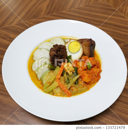 Lontong with vegetable coconut curry, egg and spicy sambal (Indonesian dish) Lontong with vegetable coconut curry, egg and spicy sambal (Indonesian dish) 133721479