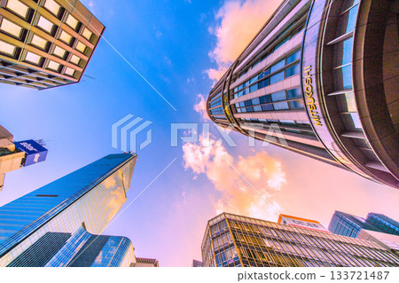 Tokyo cityscape in Japan. Nihonbashi basking in the sunset. View of the redevelopment project in Nihonbashi 1-chome and Mitsukoshi department store. Towards a new era Tokyo cityscape in Japan. Nihonbashi basking in the sunset. View of the redevelopment project in Nihonbashi 1-chome and Mitsukoshi department store. Towards a new era 133721487