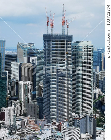 Tower crane at a tower apartment building Tower crane at a tower apartment building 133722874